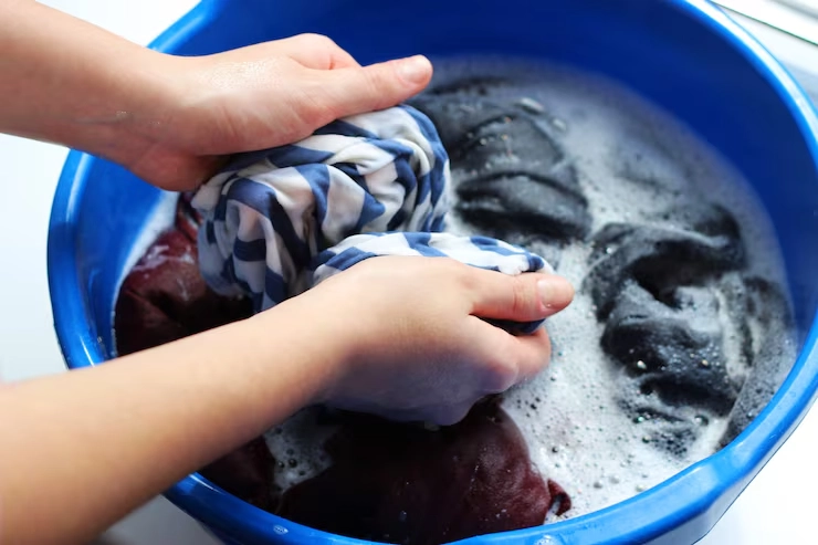 hand washes clothes